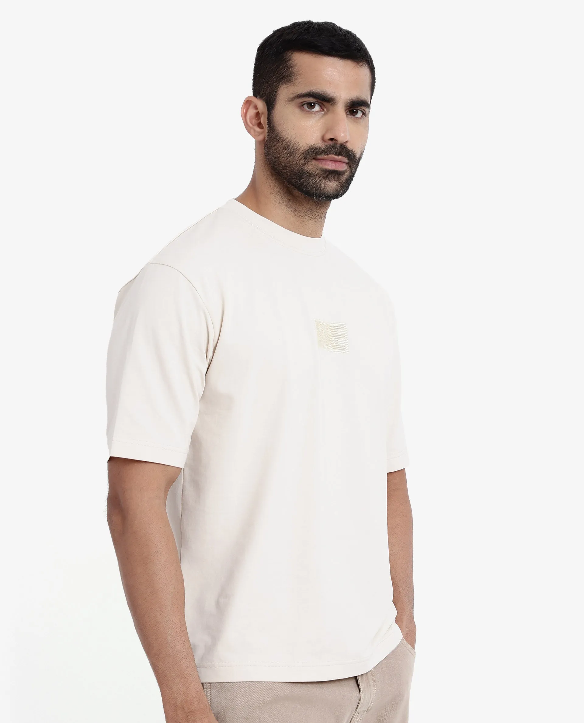 Rare Rabbit Men Reborn-T Beige Cotton Fabric Short Sleeve Crew Neck Oversized Fit Graphic Print T-Shirt